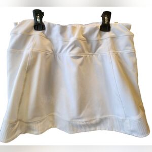 Athleta skirt with reflective stripes and built-in shorts